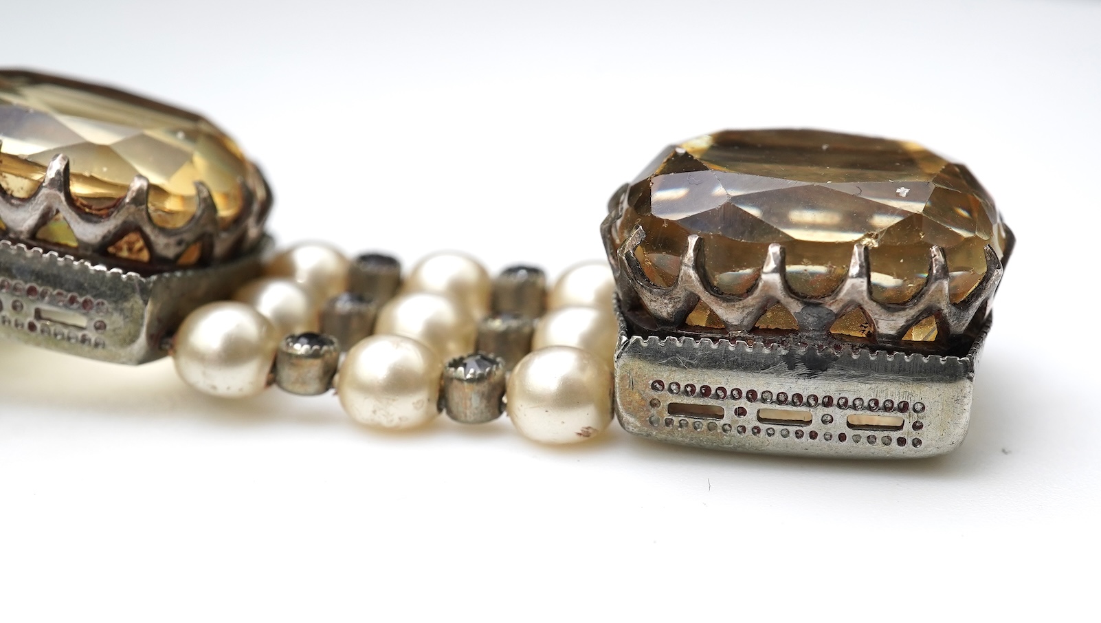 A collection of citrine jewels and a paste bracelet